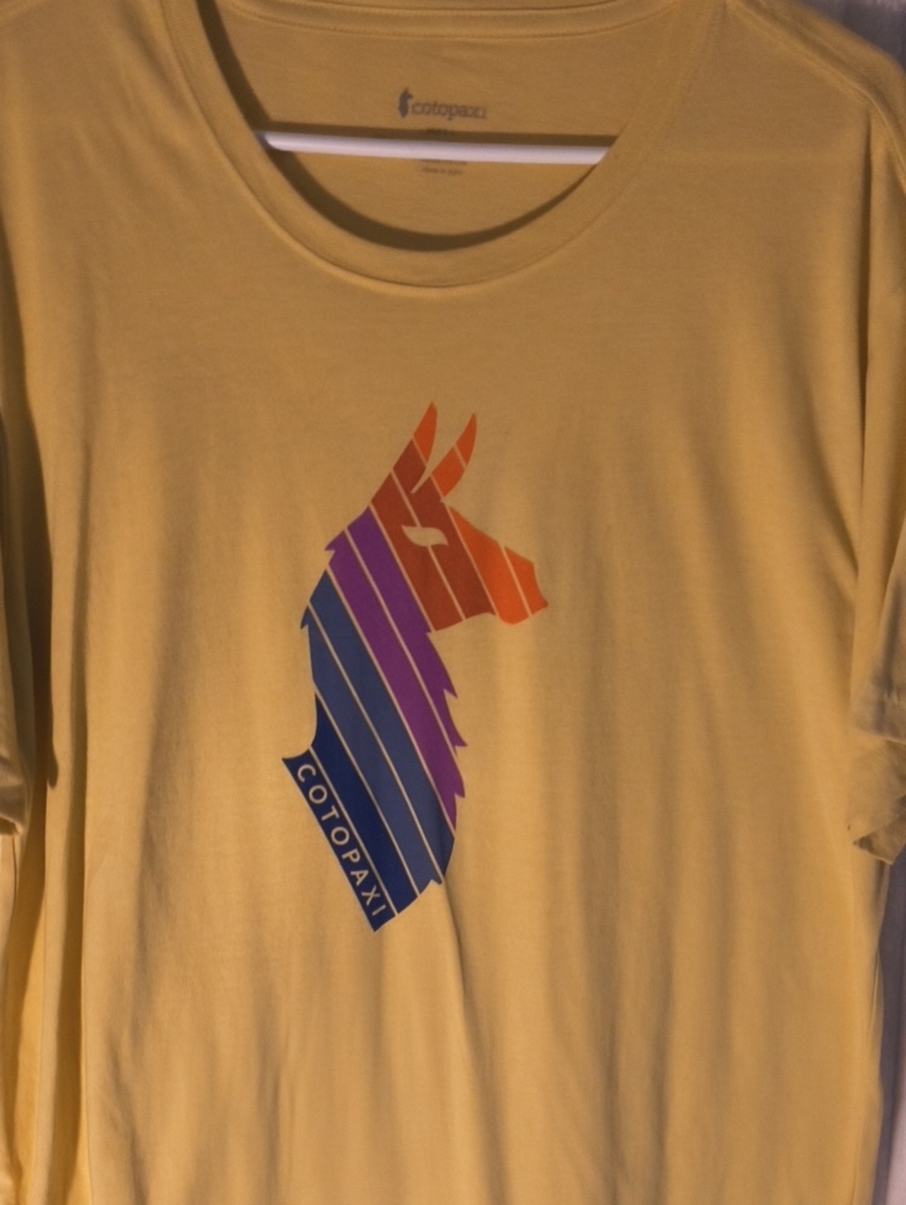 cotopaxi Yellow Tee with Rainbow Llama Graphic